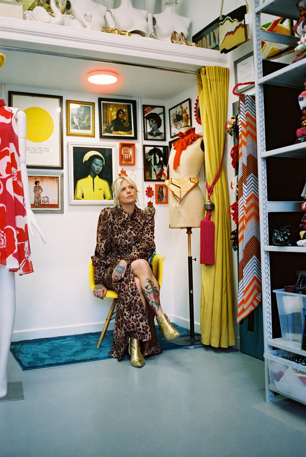 Holly Campbell in a leopard-print dress seated in her Edinburgh studio