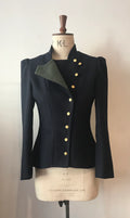 A 2-tone fencing jacket displayed on a mannequin, with contrasting front-facing panels in a different color and gold buttons.